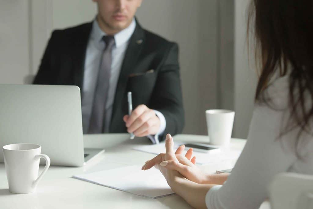 Close up of business people hands at office desk